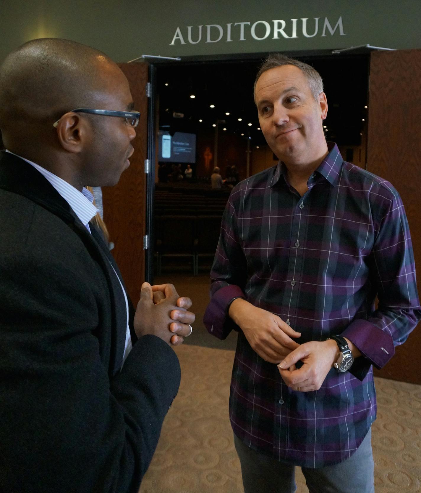 River Valley Church, Apple Valley. Pastor Rob Ketterling, right, and parishinoer. Photo by Dylan Peers McCoy, Special to the Star Tribune