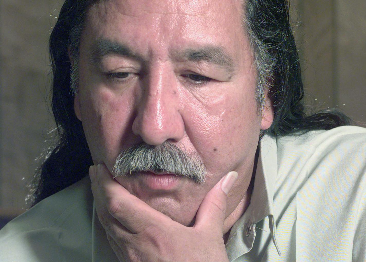 FILE - In this April 29, 1999, file photo, American Indian activist Leonard Peltier speaks during an interview at the U.S. Penitentiary at Leavenworth, Kan. President Barack Obama has denied a clemency request by Peltier, who has spent most of his life in prison in the killing of two FBI agents in South Dakota in 1975. Peltier's attorney, Martin Garbus, says they received a letter from the White House on Wednesday Jan. 18, 2017 saying their application has been denied. (Joe Ledford/The Kansas Ci