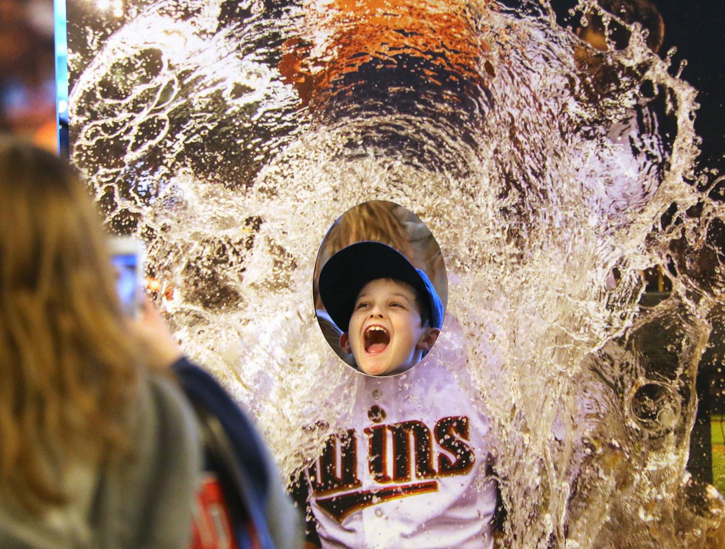 Twins fan Conner Tax, 8, of Watertown, MN, poses in a cut out of a Twins player taking a Gatorade bath while he gets his photo taken at Twinsfest, Friday, Jan. 29, 2016, at Target Field in Minneapolis, MN. ](DAVID JOLES/STARTRIBUNE)djoles@startribune.com Twinsfest returned to Target Field for the 2016 season.**Conner Tax,cq