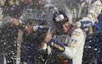Chase Elliott celebrated his victory with his pit crew after winning a NASCAR Cup race at Watkins Glen International on Sunday.