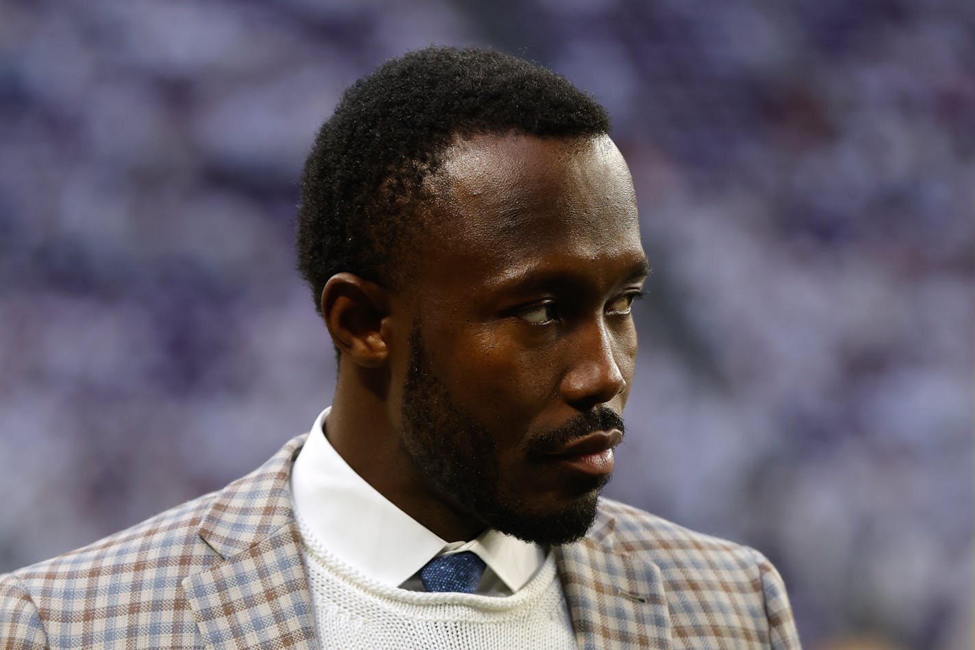 Minnesota Vikings general manager Kwesi Adofo-Mensah walks on the field before an NFL football game against the Detroit Lions, Sunday, Dec. 24, 2023, in Minneapolis. (AP Photo/Bruce Kluckhohn)