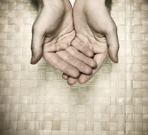 Image of hands in need, from istock.