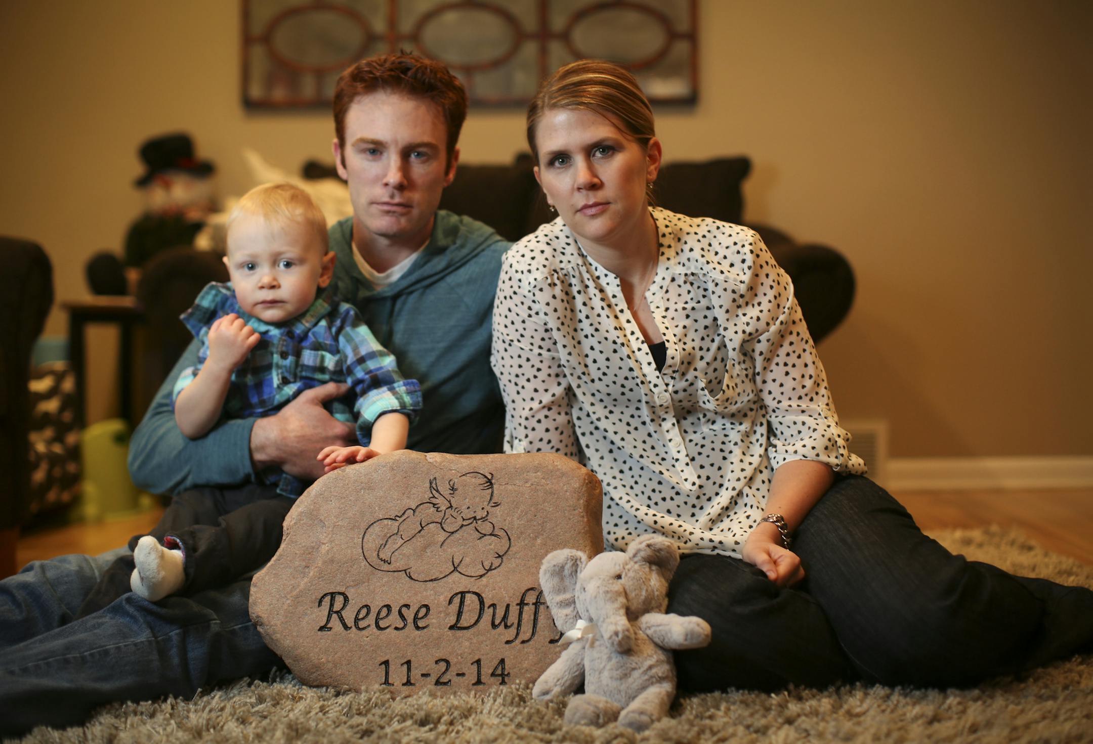 Chris and Amanda Duffy's baby girl Reese was born this November stillborn. They posed for a picture with their older son Rogen and a stone they keep in front of their house with her name and birthdate. Photographs taken on Wednesday, March 4, 2015 in Roseville, Minn. ] RENEE JONES SCHNEIDER • reneejones@startribune.com Rogen CQ
