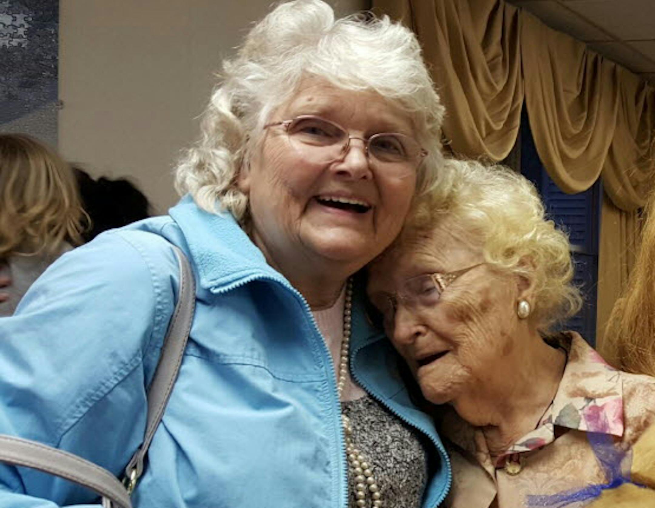 Betty Morrell, left, and her birthmother, Lena Pierce, 96, are reunited at the Greater Binghamton Airport on Jan. 15, 2016.