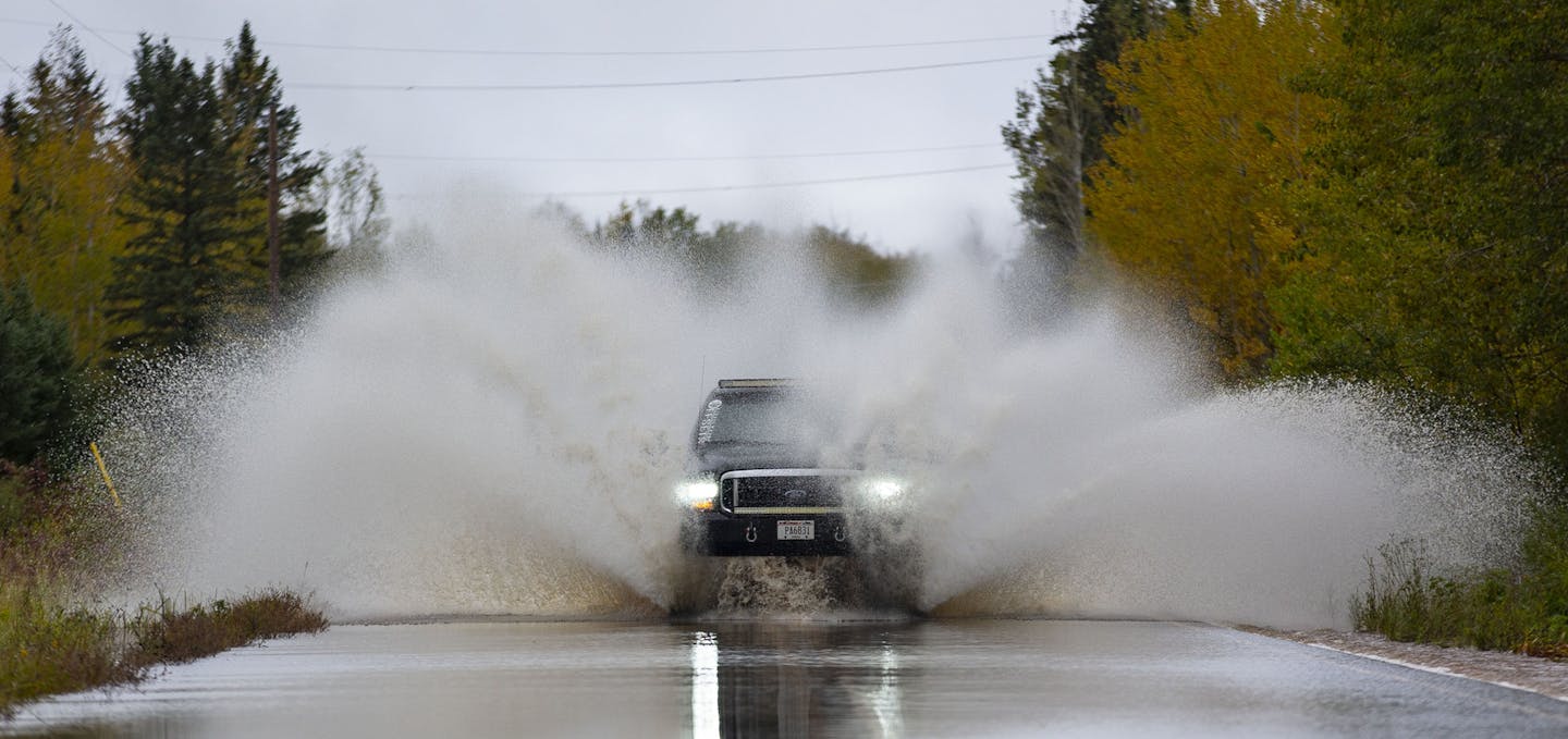 A truck passed through high water in a section of County Highway K in South Range, WI. The road was washed out and eventually closed off on Monday morning due to heavy rain that started Sunday night. ]
ALEX KORMANN &#x2022; alex.kormann@startribune.com Northwestern Wisconsin saw some severe flash flooding Monday morning that washed out and damaged several roads, forcing authorities tossup down parts of County Highway K.