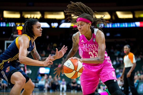Minnesota Lynx guard Seimone Augustus takes the ball past Indiana Fever�s Candice Dupree during the first half on Friday, Aug. 18, 2017, at Xcel Ene
