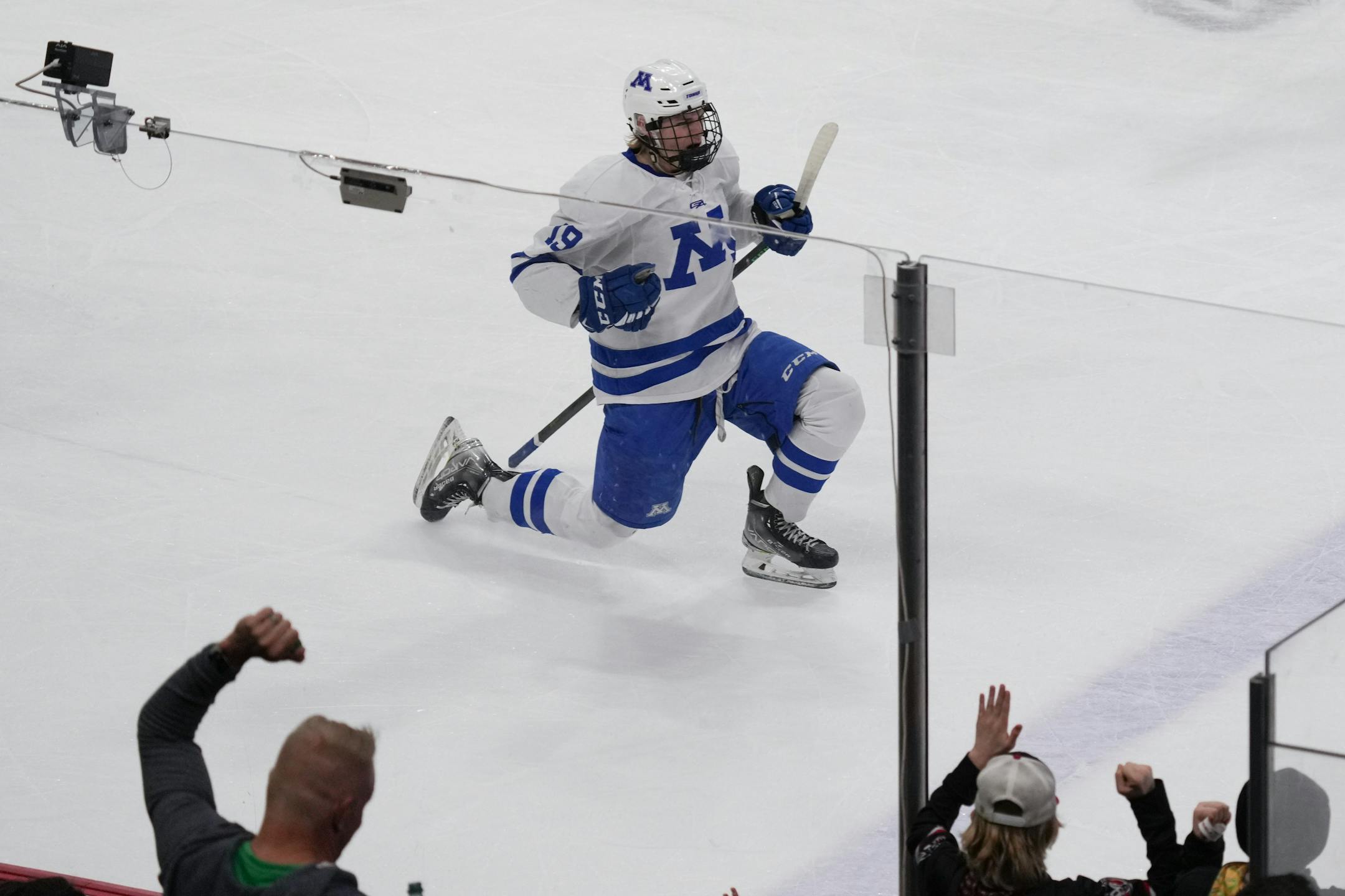 Minnetonka forward Hagen Burrows (19) scores the first goal of the game against Edina in the first period.