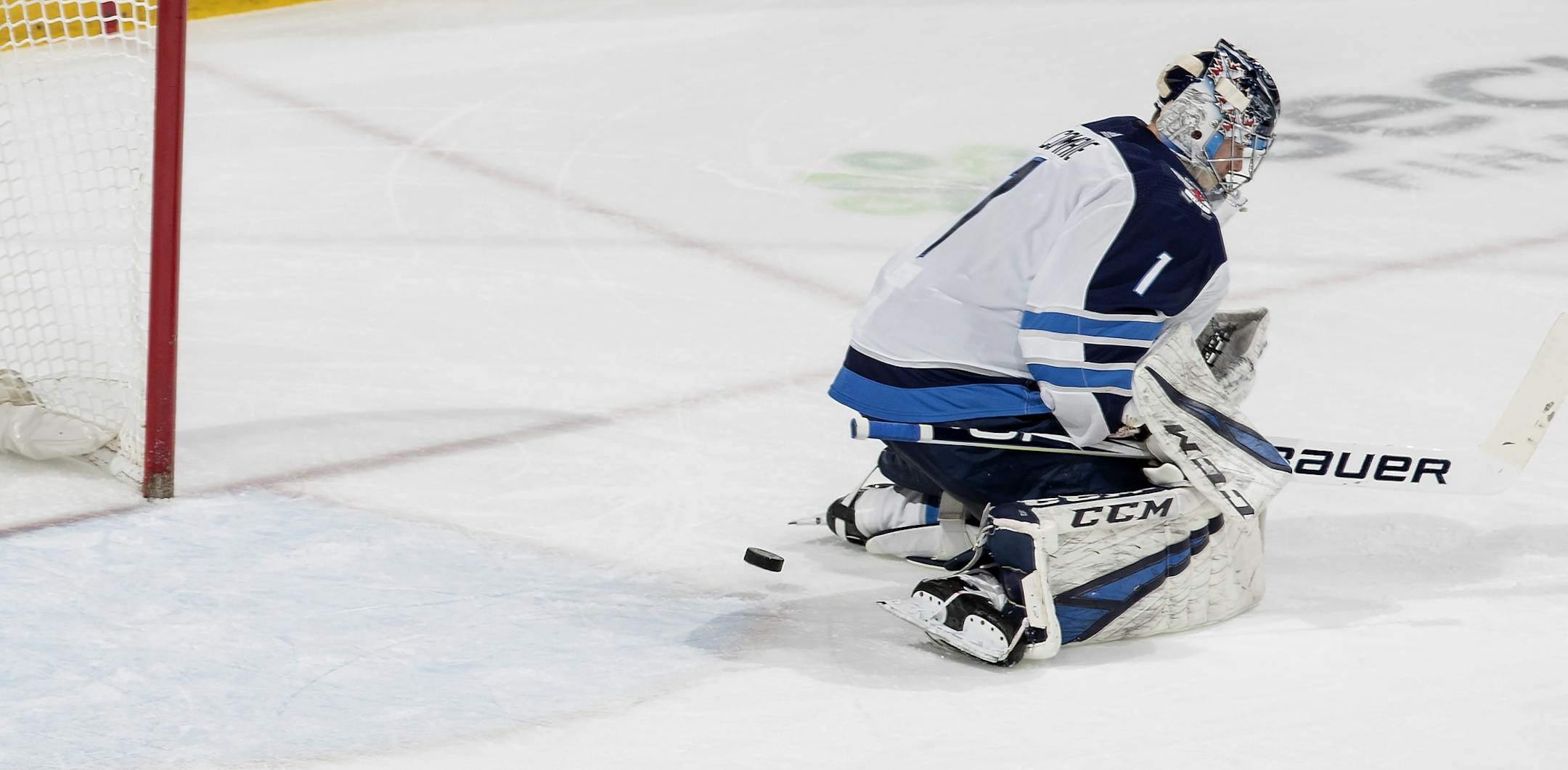 Marcus Foligno (17) got the puck past Jets goalie Eric Comrie (1) for a goal in the third period.