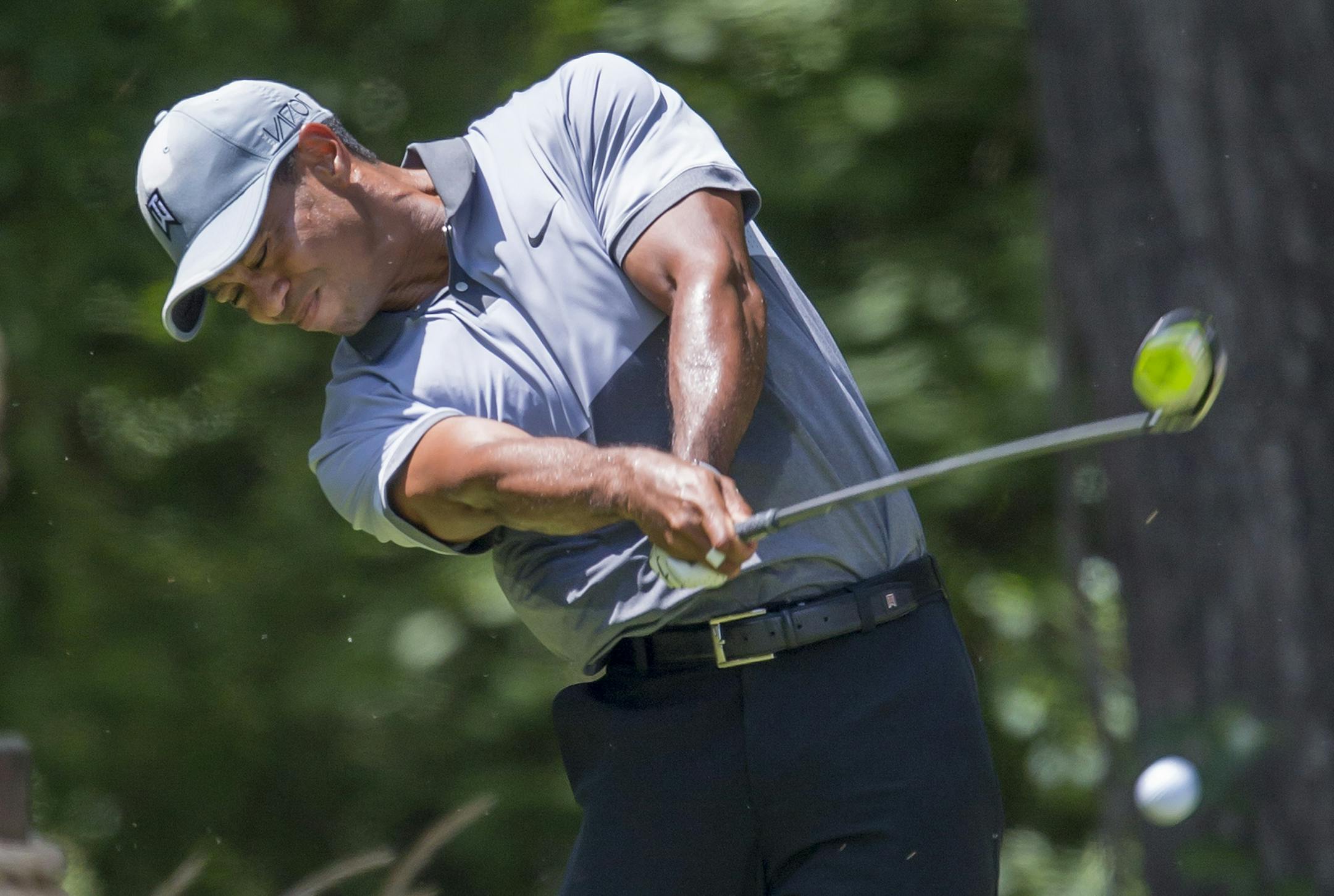 Tiger Woods tees off on the second hole during the third round of the Wyndham Championship golf tournament at Sedgefield Country Club in Greensboro, N.C., Saturday, Aug. 22, 2015. (AP Photo/Rob Brown)