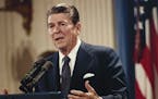 FILE - In this Oct. 19, 1983 file photo, President Ronald Reagan speaks during a news conference at the White House in Washington. President Barack Ob