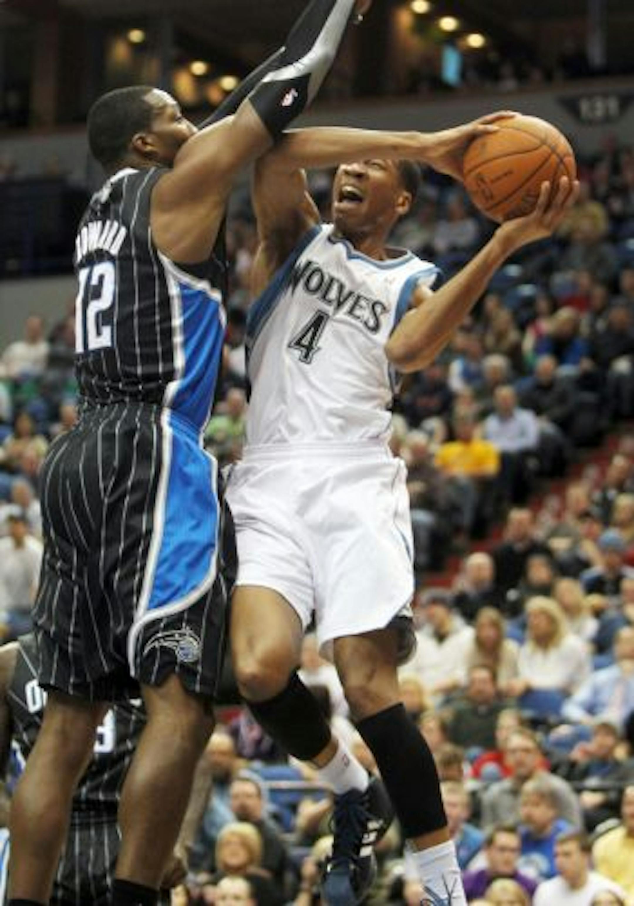 The Wolves' Wes Johnson drew a foul from Orlando's Dwight Howard in the first half.