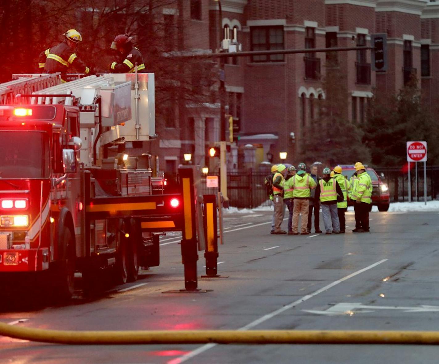 City and fire inspectors viewed the exterior of the the Francis Drake Hotel apartments on Thursday as firefighters brought down the last bucket.