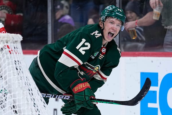 Minnesota Wild left wing Matt Boldy (12) celebrates after scoring a goal against the Philadelphia Flyers during the third period of an NHL hockey game
