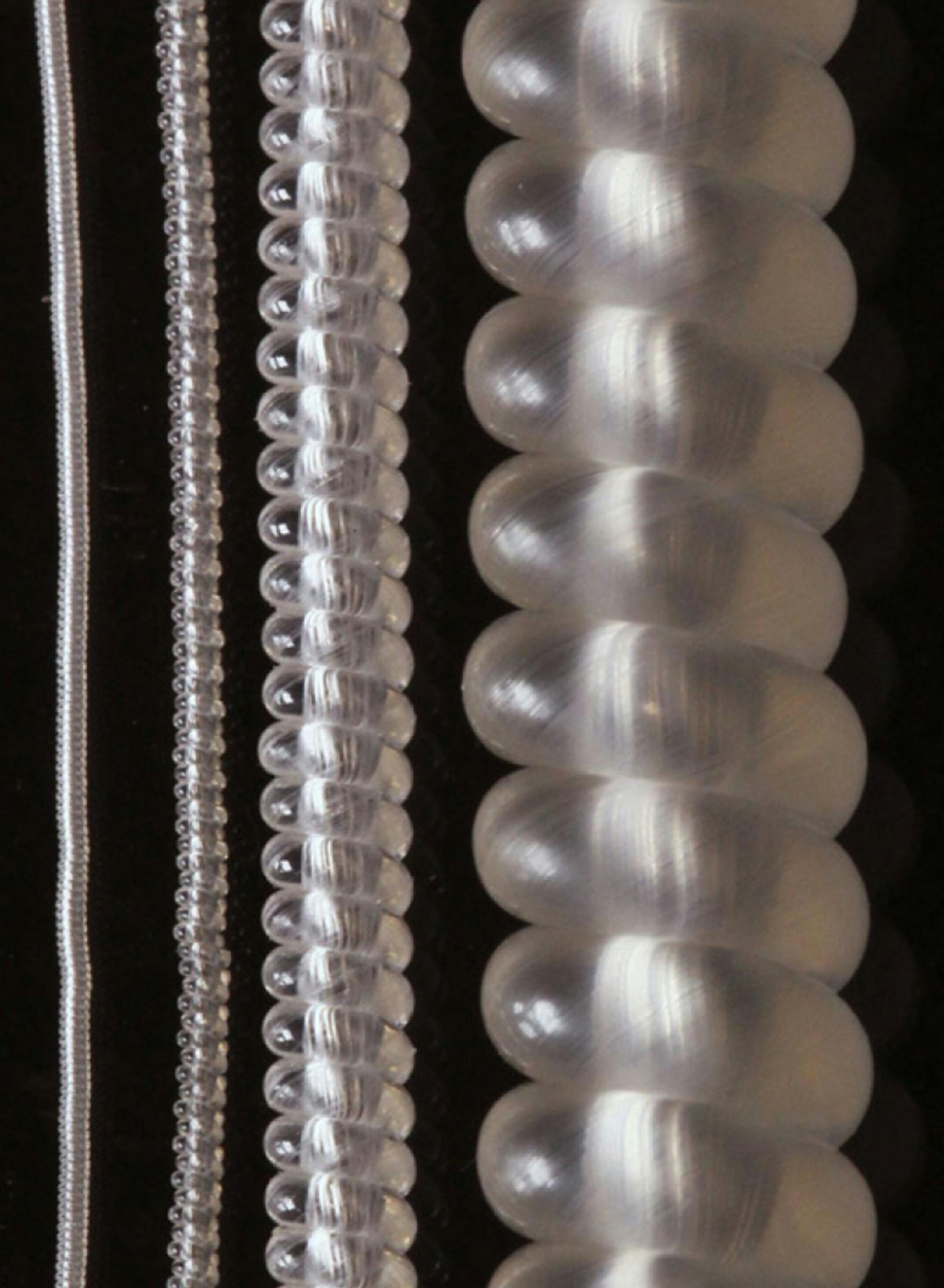 An international team of researchers report that theyíve spun common plastic fishing line and sewing thread into the most powerful artificial muscles ever created. This photo compares muscles made by coiling different sizes of nylon 6 monofilament fibers. Illustrates MUSCLE (category a), by Robert F. Service © 2014, Science/AAAS. Moved Friday, Feb.28, 2014. (MUST CREDIT: Courtesy of Science/AAAS)