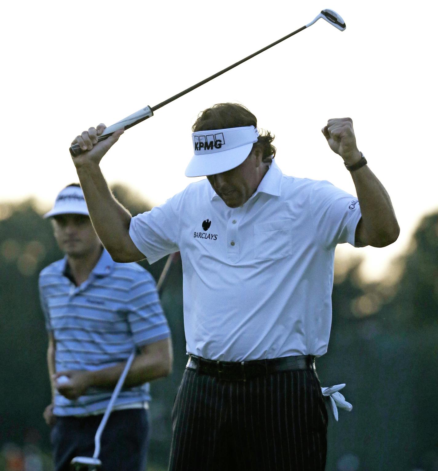 Phil Mickelson reacts after his birdie putt on the 18th hole during the second round of the U.S. Open golf tournament at Merion Golf Club, Friday, June 14, 2013, in Ardmore, Pa. (AP Photo/Morry Gash)