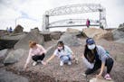 (From left) Hannah Egge, Sirivisa Vichiensan and Yoyo Lau skipped rocks on Lake Superior in Canal Park in Duluth on Friday afternoon. All three girls 