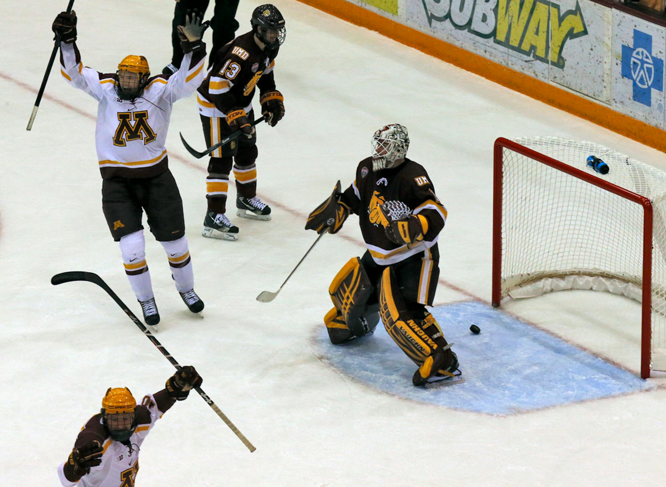 UM Gophers vs. UMD Bulldogs hockey. Gophers Tom Serratore, top, celebrated after scoring a first period goal beating Duluthe goalie Aaron Crandall on the shot. (MARLIN LEVISON/STARTRIBUNE(mlevison@startribune.com)