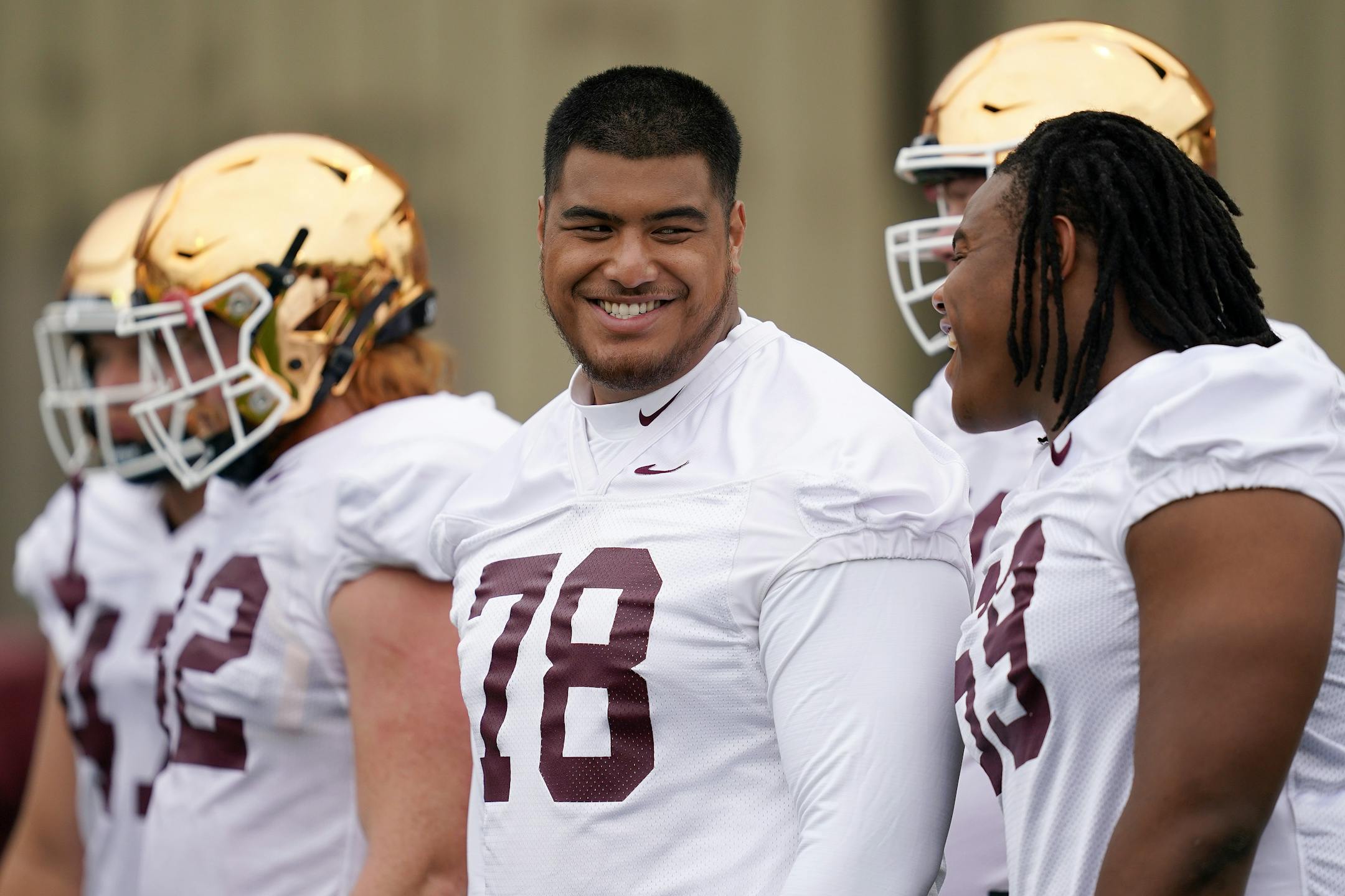 Gophers offensive lineman Daniel Faalele (78) joked with his teammates as he sat out practice Saturday. ] ANTHONY SOUFFLE • anthony.souffle@startribune.com