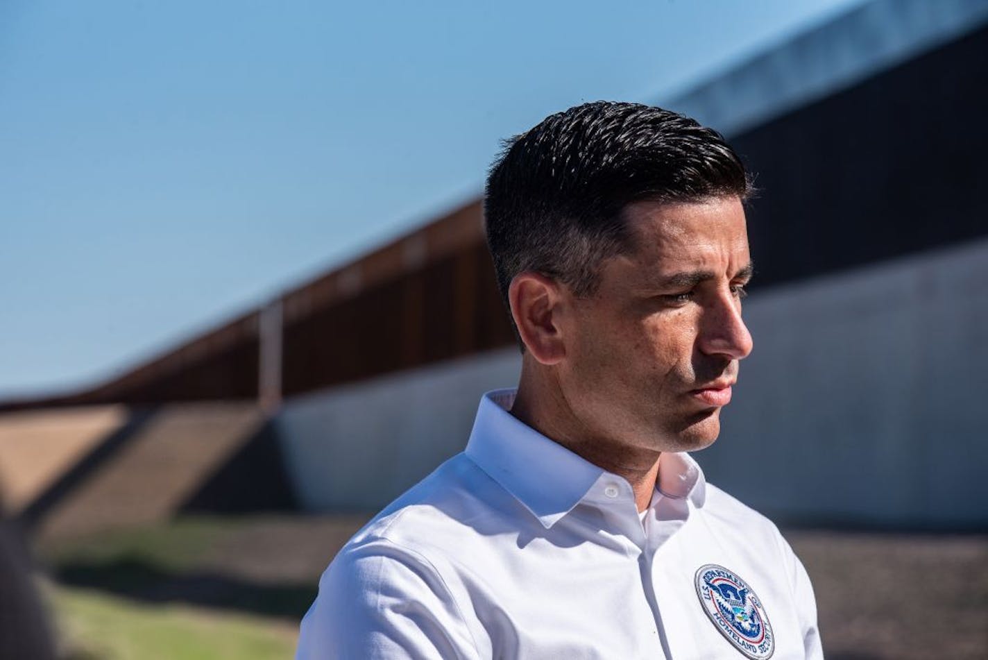 Chad Wolf, acting Secretary of Homeland Security, speaks to reporters near a border wall construction site near McAllen, Texas, Oct. 29, 2020.