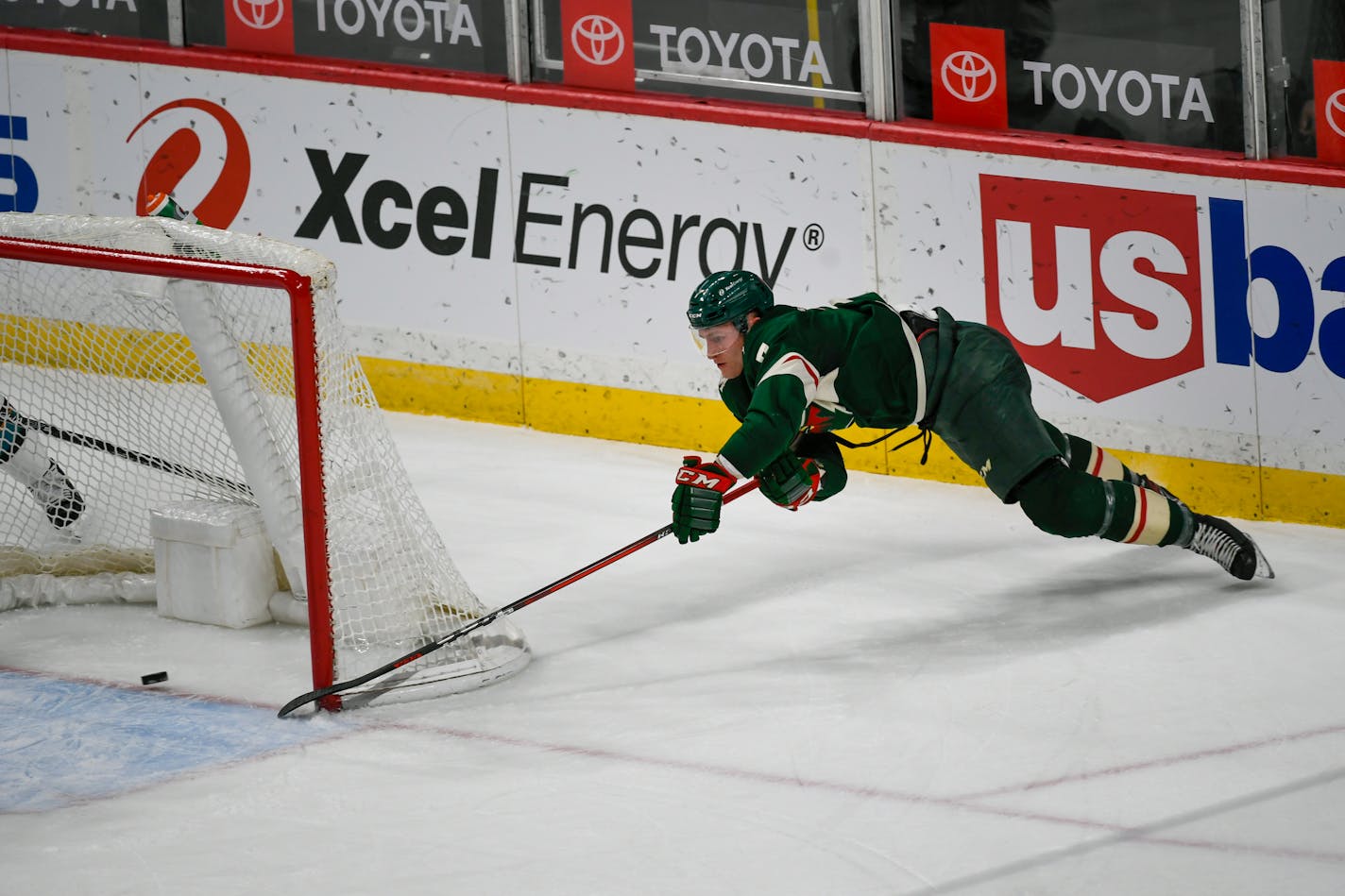 Wild center Nico Sturm&nbsp;makes a wraparound shot for goal against the San Jose Sharks during the second period