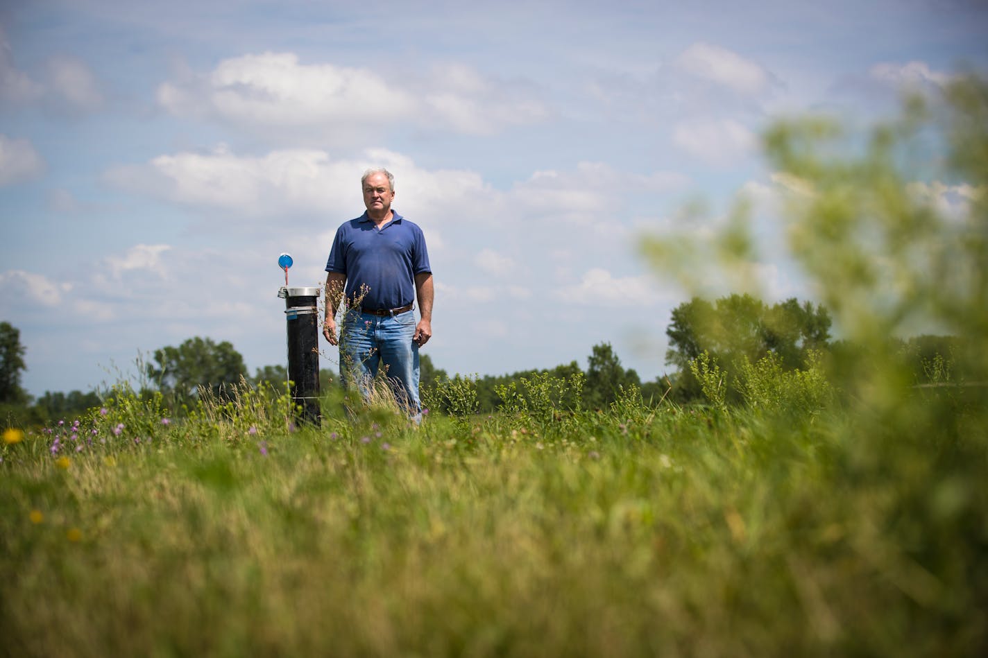 Michael McGowan runs the second-generation closed Freeway Landfill, a site that the Minnesota Pollution Control Agency has been trying for years to clean up. McGowan's family fought closing the landfill, and has fought more recently to keep it from being cleaned up. They've said the cleanup isn't necessary, and are worried it'll jeopardize another business they have on the site, as well as future development plans. Michael McGowan was photographed on the site of the closed landfill by one of the