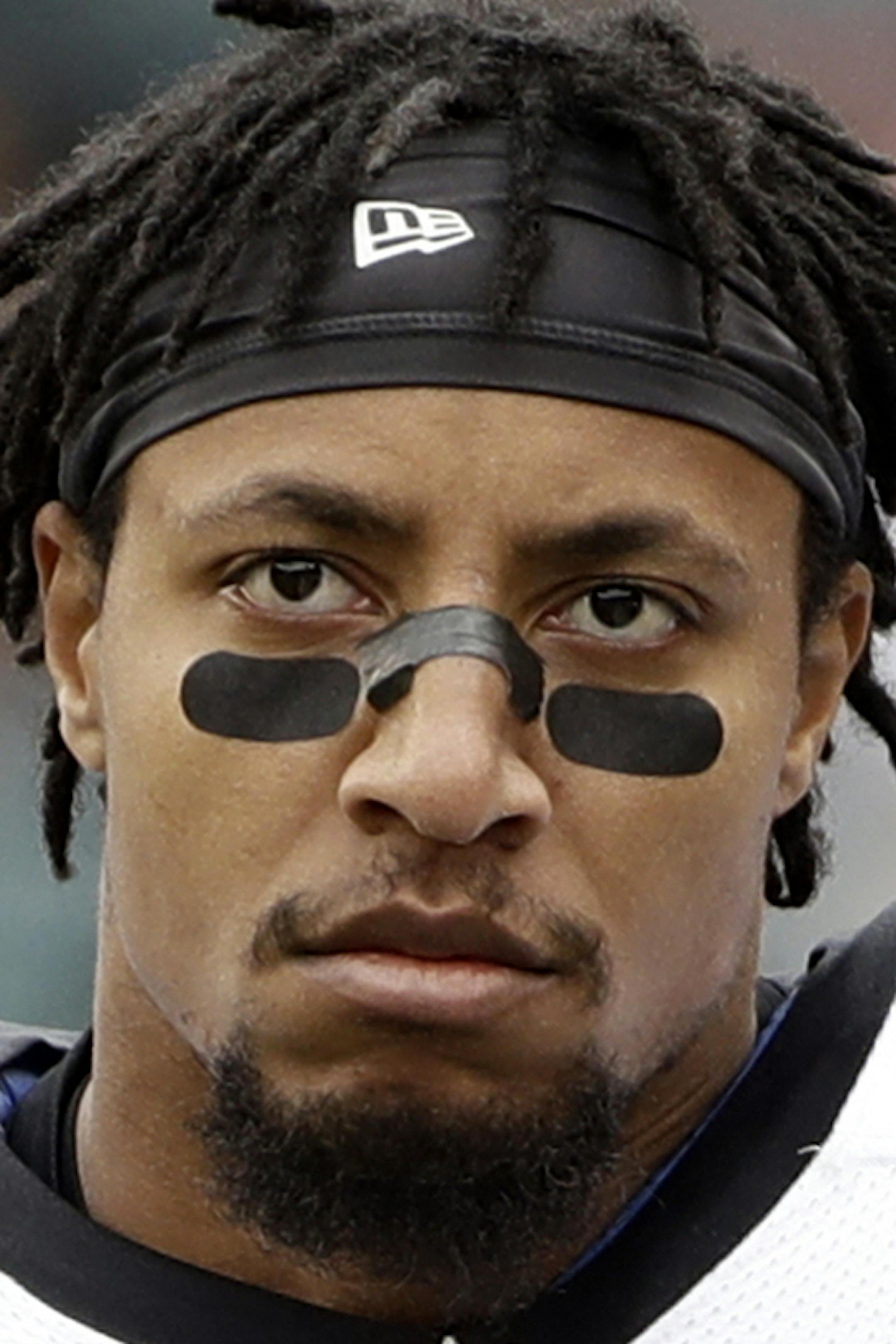 FILE - In this Oct. 21, 2018, file photo, Carolina Panthers strong safety Eric Reid stands on the sideline prior to an NFL football game against the Philadelphia Eagles, in Philadelphia. The Panthers have re-signed safety Eric Reid to a three-year contract that runs through the 2021 season. Financial terms of the deal were not announced Monday, Feb. 11, 2019. (AP Photo/Matt Rourke, File)