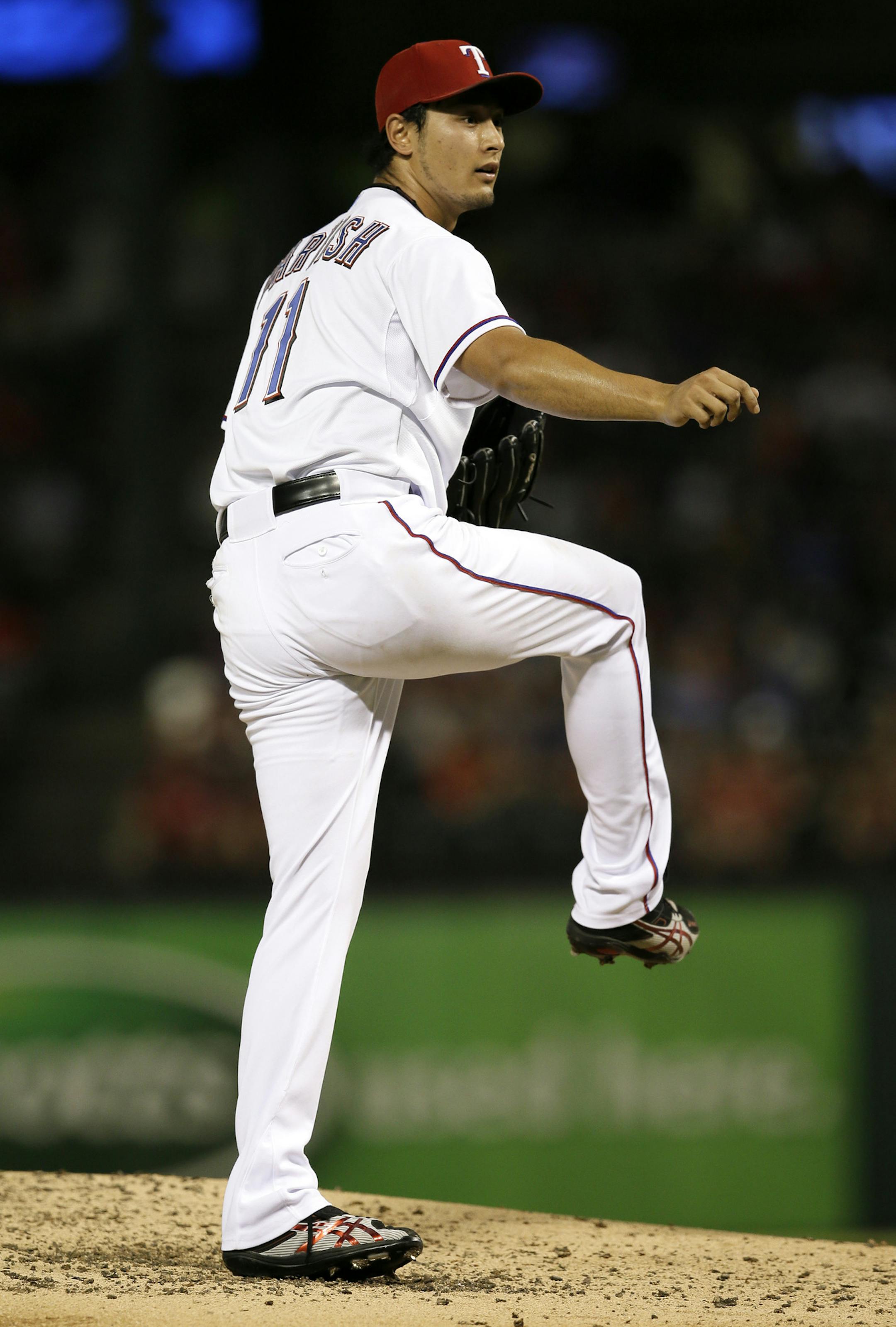 Texas Rangers starting pitcher Yu Darvish (11) of Japan works against the Minnesota Twins in a baseball game, Friday, Aug. 30, 2013, in Arlington, Texas. The Twins won 3-2. (AP Photo/Tony Gutierrez) ORG XMIT: MIN2013090623015632