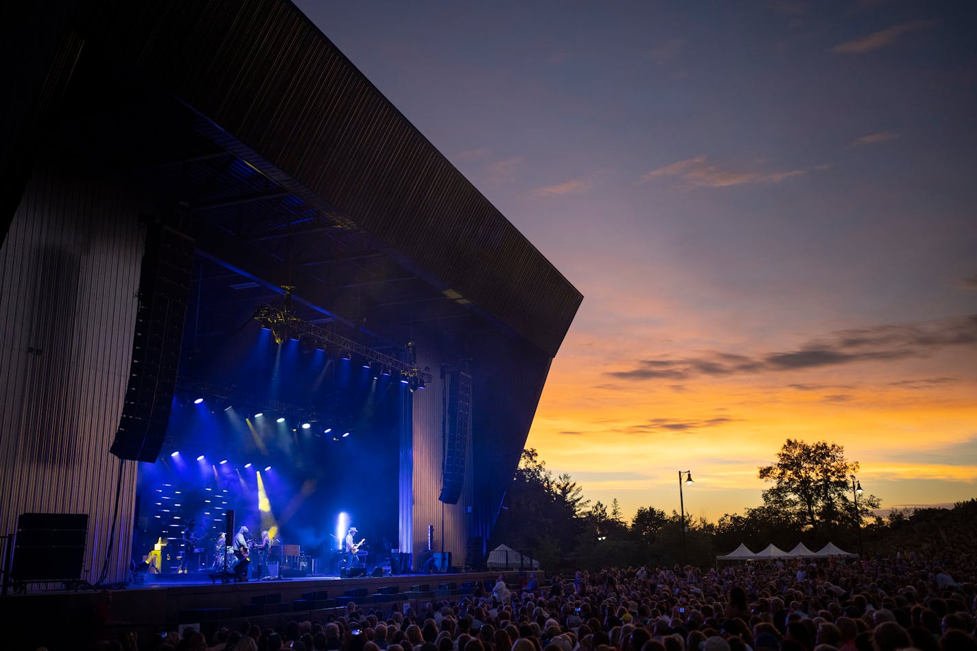 Sheryl Crow and her band early in their set at The Ledge Amphitheater in Waite Park, Minn. Tuesday.