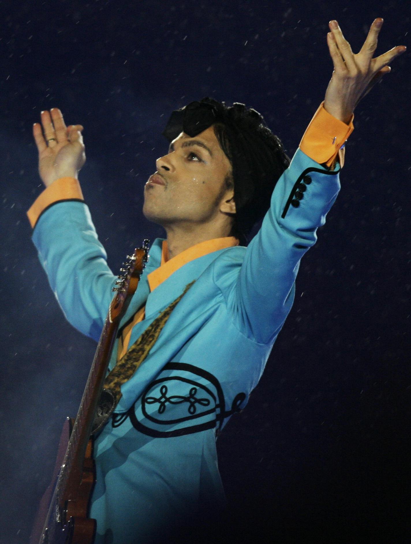 FILE- In this Feb. 4, 2007, file photo, Prince performs during the halftime show at Super Bowl XLI at Dolphin Stadium in Miami. In an industry where collaborations with other artists and credits are negotiated as heavily as world treaties, Prince followed only one credo when it came to working with others: the love of the music. Prince died Thursday, April 21, 2016, at his home outside Minneapolis. (AP Photo/Alex Brandon, File)