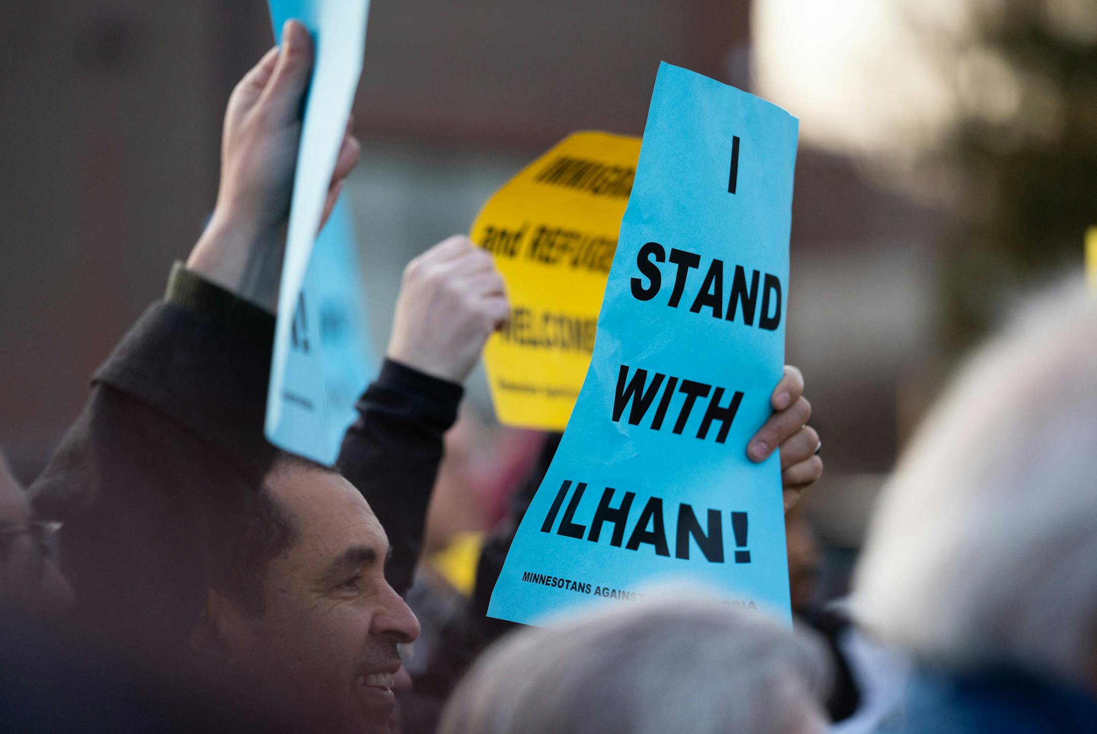 Passing motorists gave occasional waves and honks of supports as supporters flanked both sides of Plymouth Ave. North. ] MARK VANCLEAVE ¥ About a hundred people gathered outside of the Minneapolis Urban League to counter criticism of Rep. Ilhan Omar in light of her controversial remarks on topics including Palestine and Venezuela on Wednesday, Apr 3, 2019.