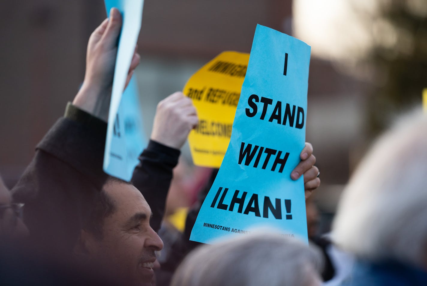 Passing motorists gave occasional waves and honks of supports as supporters flanked both sides of Plymouth Ave. North. ] MARK VANCLEAVE &#xa5; About a hundred people gathered outside of the Minneapolis Urban League to counter criticism of Rep. Ilhan Omar in light of her controversial remarks on topics including Palestine and Venezuela on Wednesday, Apr 3, 2019.