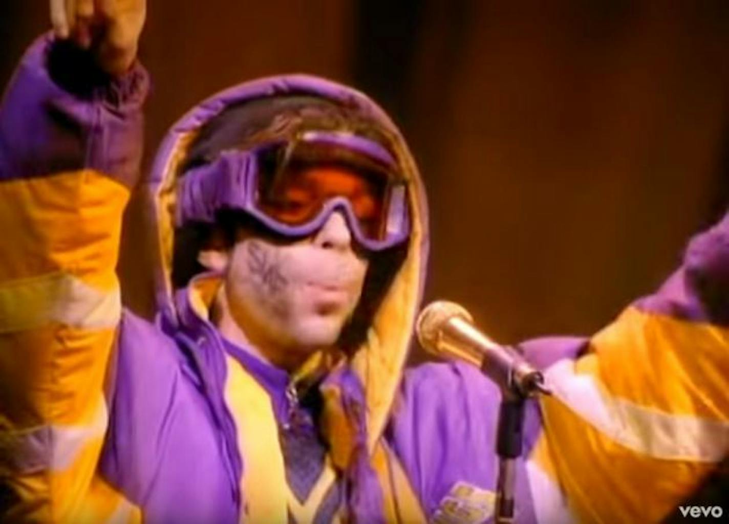 Prince wasn't exactly at his most glam but he was slamming in the "Rock and Roll Is Alive" video.