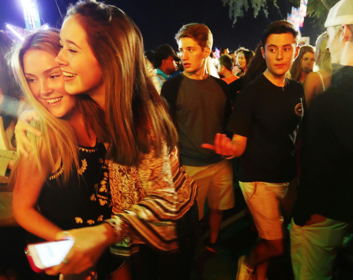 As is the case on most evenings, teens hung out near the Midway at the Minnesota State Fair Friday, Aug. 26, 2016, in Falcon Heights, MN. Here, Matt Connolly, 16, right to left, Nick Wallisch, 17, and Deveney Flood, 16, friends and classmates at St. Agnes School in St. Paul, hung out with others at the State Fair.](DAVID JOLES/STARTRIBUNE)djoles@startribune For teenagers, the State Fair is a meeting ground filled with important social landmarks. Going to the fair alone, they say, is a key step i