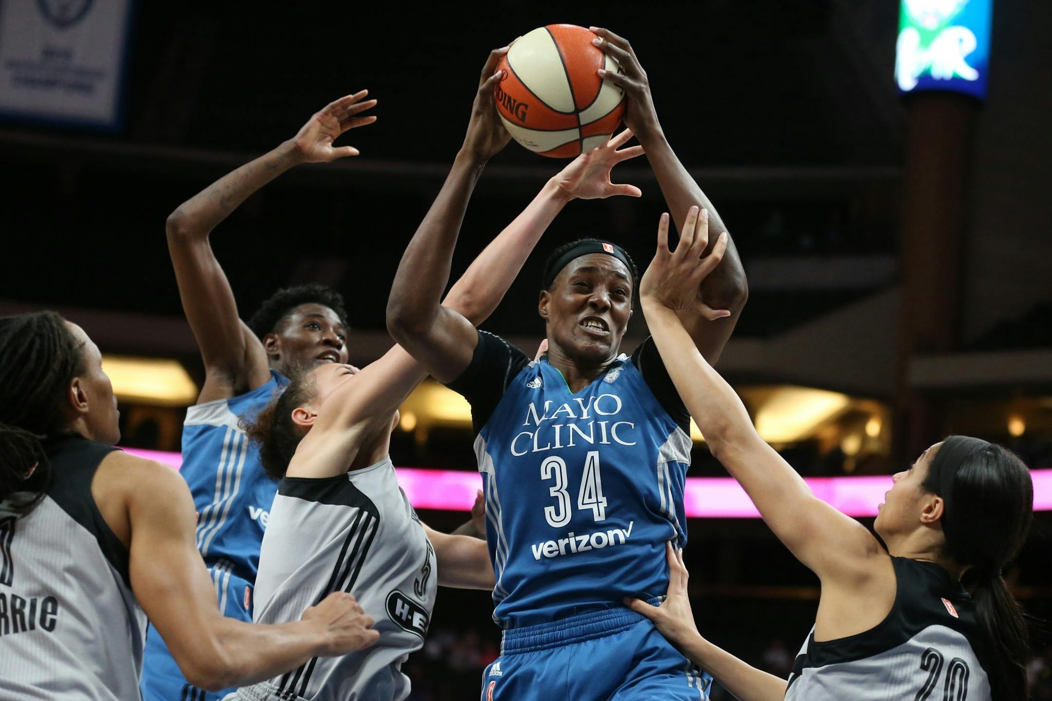 Minnesota Lynx center Sylvia Fowles (34) pulled down and rebound over San Antonio Stars forward Dearica Hamby left and Isabelle Harrison (20) Sunday, June 25, 2017 at Xcel Energy Center in St. Paul , MN.