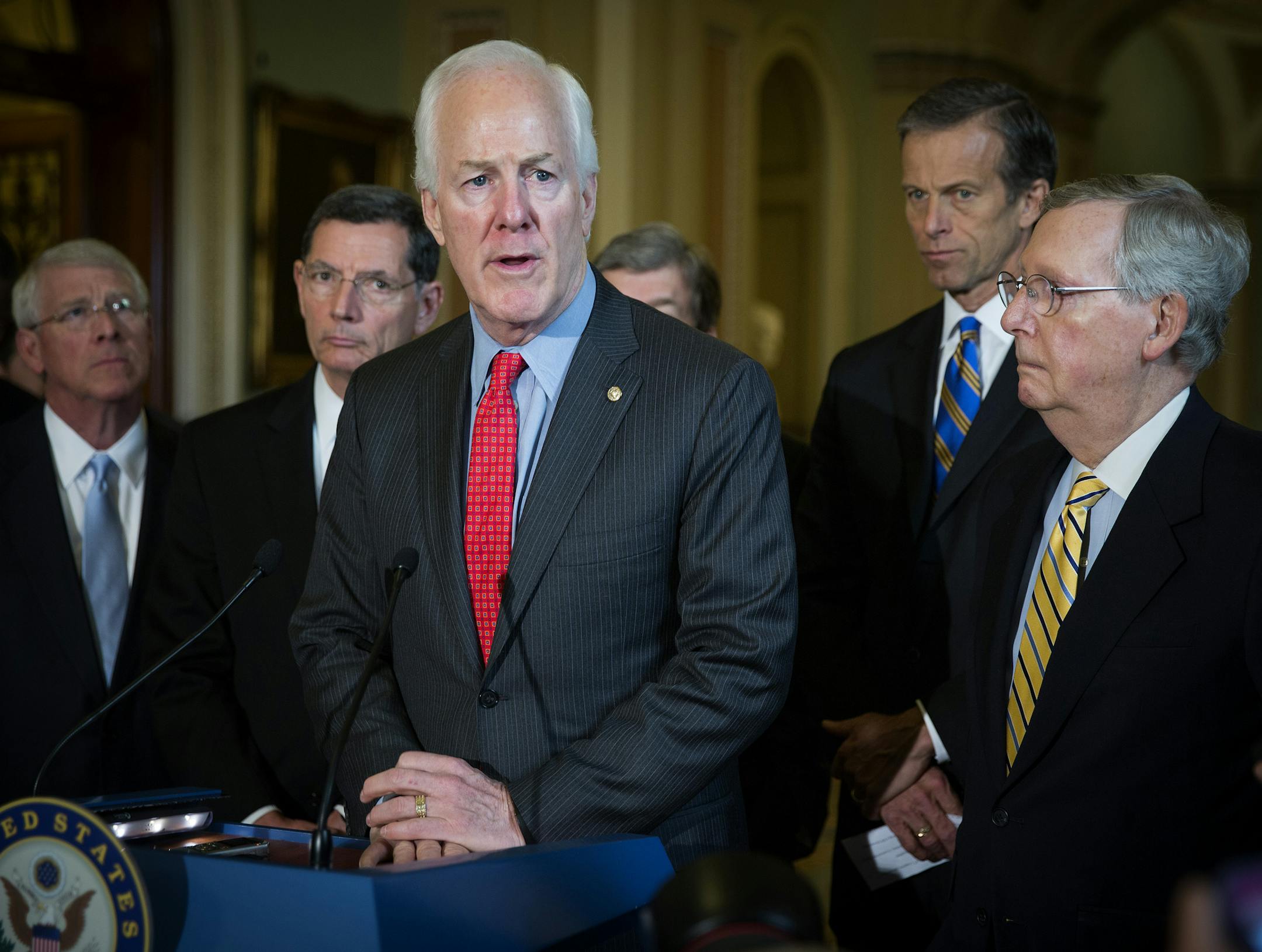 Sen. John Cornyn (R-Texas) center, with Senate Majority Leader Mitch McConnell (R-Ky.), right, and other Senate Republicans, during a news conference about a bill to help victims of sex trafficking, at the Capitol in Washington, April 21, 2015. After weeks of difficult negotiations, the Senate on Tuesday reached an agreement on the bill, paving the way for a confirmation vote on Loretta Lynch as attorney general. (Doug Mills/The New York Times)