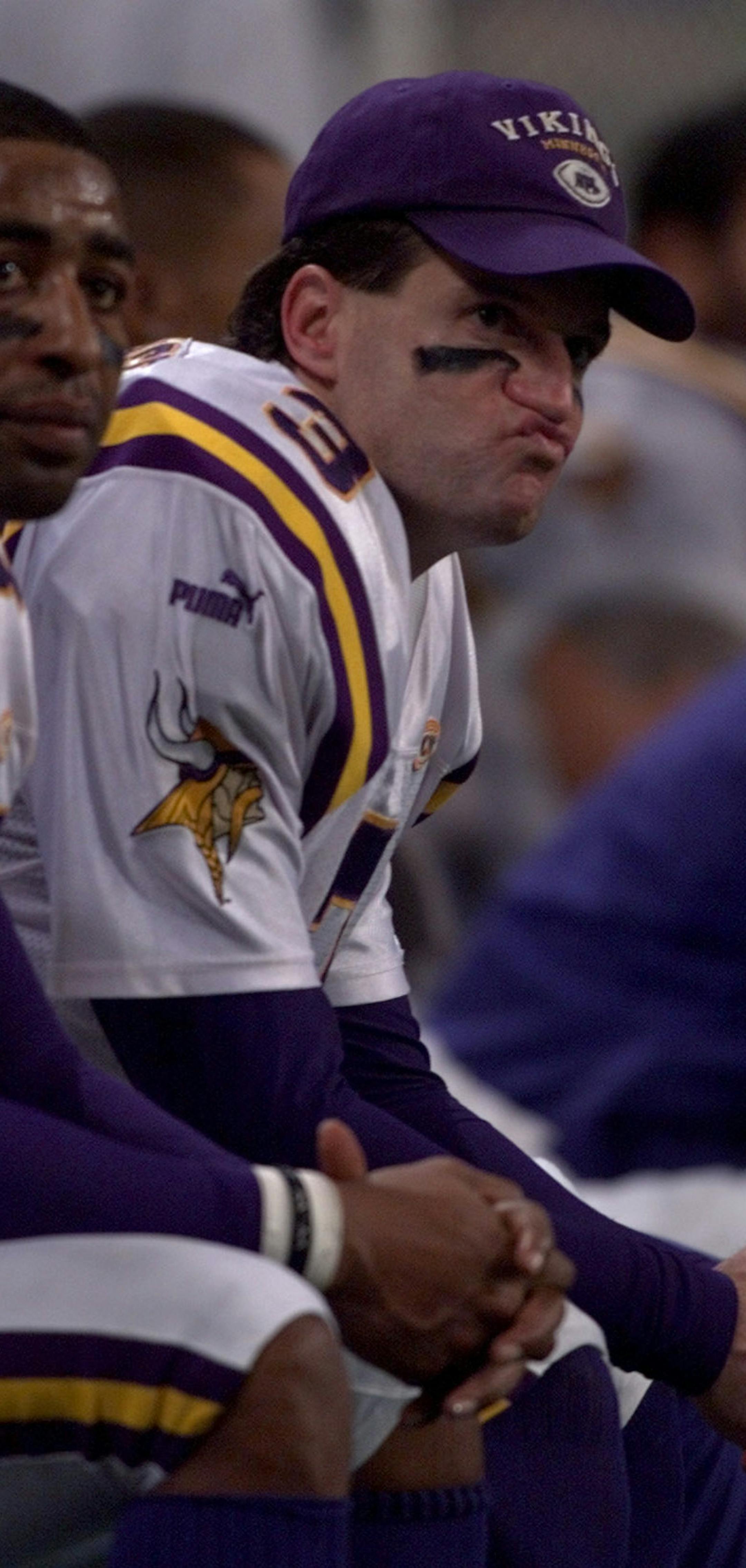St. Louis, MO- Minnesota Vikings vs St. Louis Rams -- The Vikings Cris Carter, left, and quarterback Jeff George sit on the bench during the Rams final scoring drive of the fourth quarter Sunday afternoon.