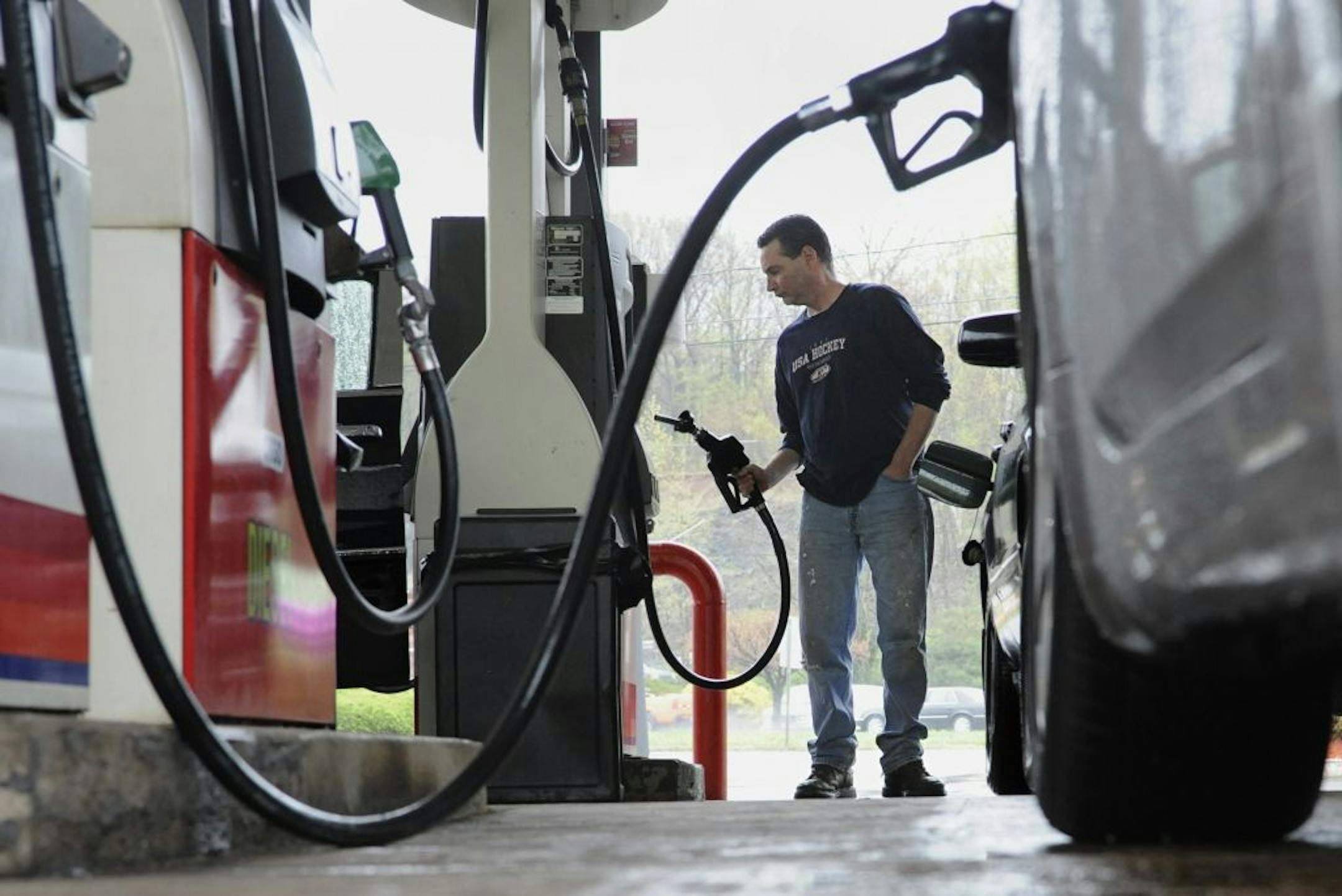FILE- In this April 28, 2011 file photo, John Magel, of Wetherfield, pumps gas at a station in Wethersfield, Conn. U.S. consumers paid more for gas and food in April, pushing inflation to its highest level in two and a half years. But so far in May 2011, inflationary pressures have begun to ease.