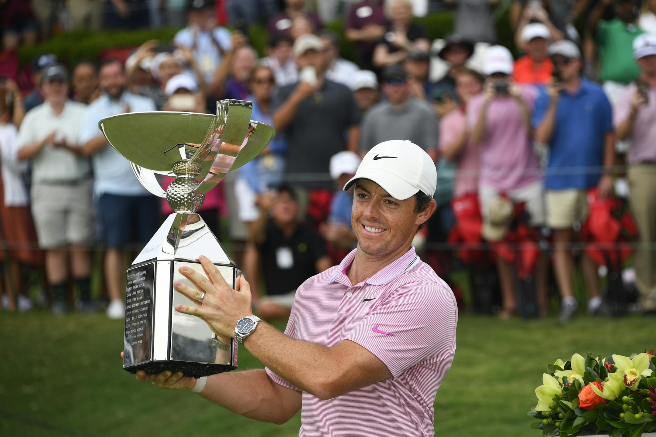 Rory McIlroy, of Northern Ireland, holds up the FedEx Cup trophy after winning the Tour Championship golf tournament Sunday, Aug. 25, 2019, in Atlanta. (AP Photo/John Amis)