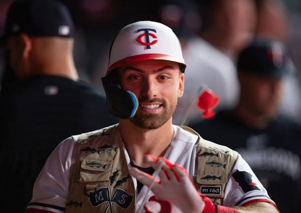 Edouard Julien donned the "Land of 10,000 Rakes" fishing vest in the dugout after his eighth-inning pinch-hit homer put the Twins ahead for good in an