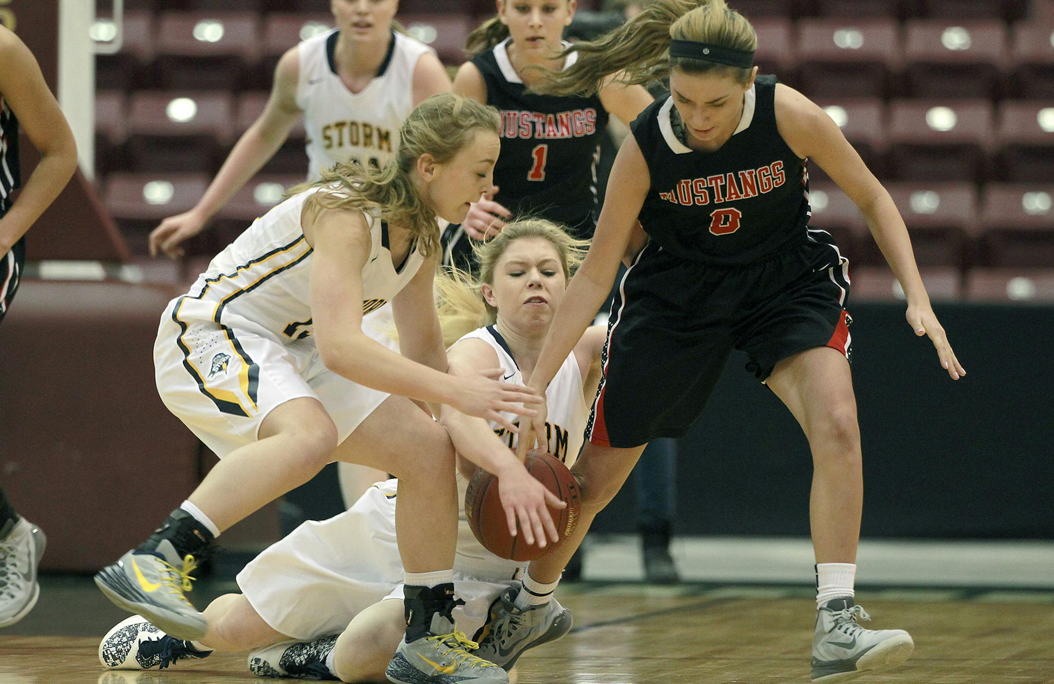 Stephen-Argyle's Autumn Thompson, left, Emily Haugen, center, and Maranatha Christian's Lexi Lee battled for the ball during the second half of the Class 1A girls' basketball quarterfinals, Thursday, March 19, 2015 at Mariucci Arena in Minneapolis, MN. [ELIZABETH FLORES • eflores@startribune.com]