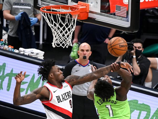 Portland Trail Blazers forward Nassir Little (9) blocked a shot by Minnesota Timberwolves forward Anthony Edwards (1) in the first half.