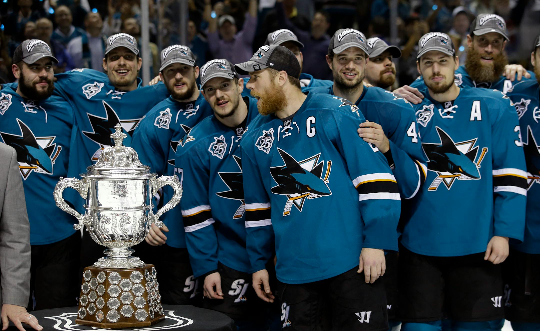 The San Jose Sharks pose for photos after a 5-2 win over the St. Louis Blues during Game 6 of the NHL hockey Stanley Cup Western Conference finals Wednesday, May 25, 2016, in San Jose, Calif. (AP Photo/Marcio Jose Sanchez)