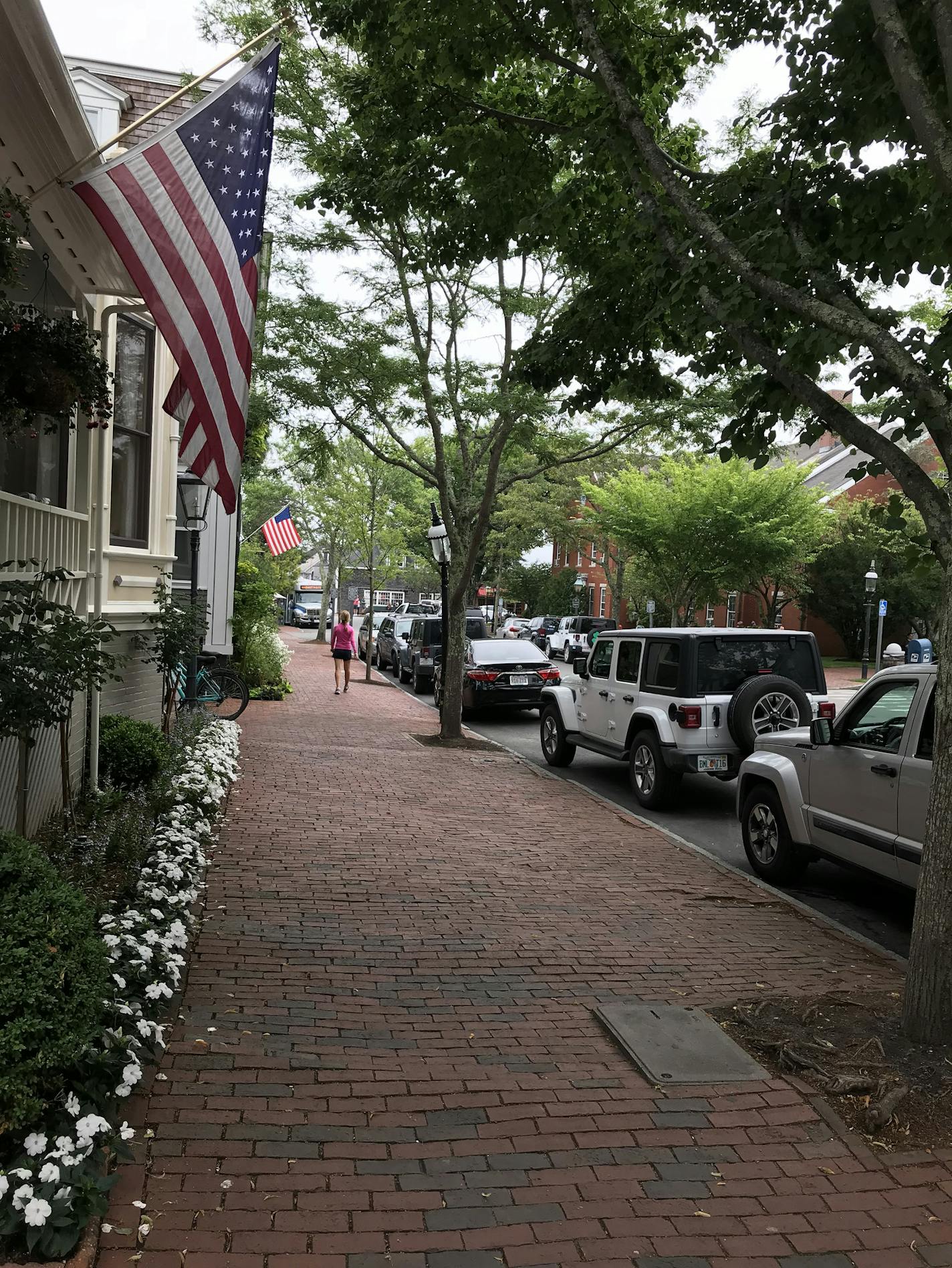 In Natucket's downtown, cobblestone sidewalks, American flags and an abundance of flowers pour on the charm. Kerri Westenberg/kwestenberg@startribune.com