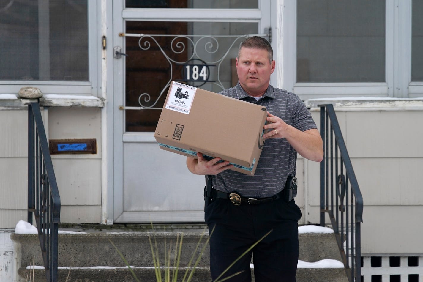 Sgt. Dave Strecker with the St. Paul Police Department retrieved a package containing a GPS tracker in it that was placed on a resident's front steps by police officers to try and catch package thieves in the act Tuesday afternoon.