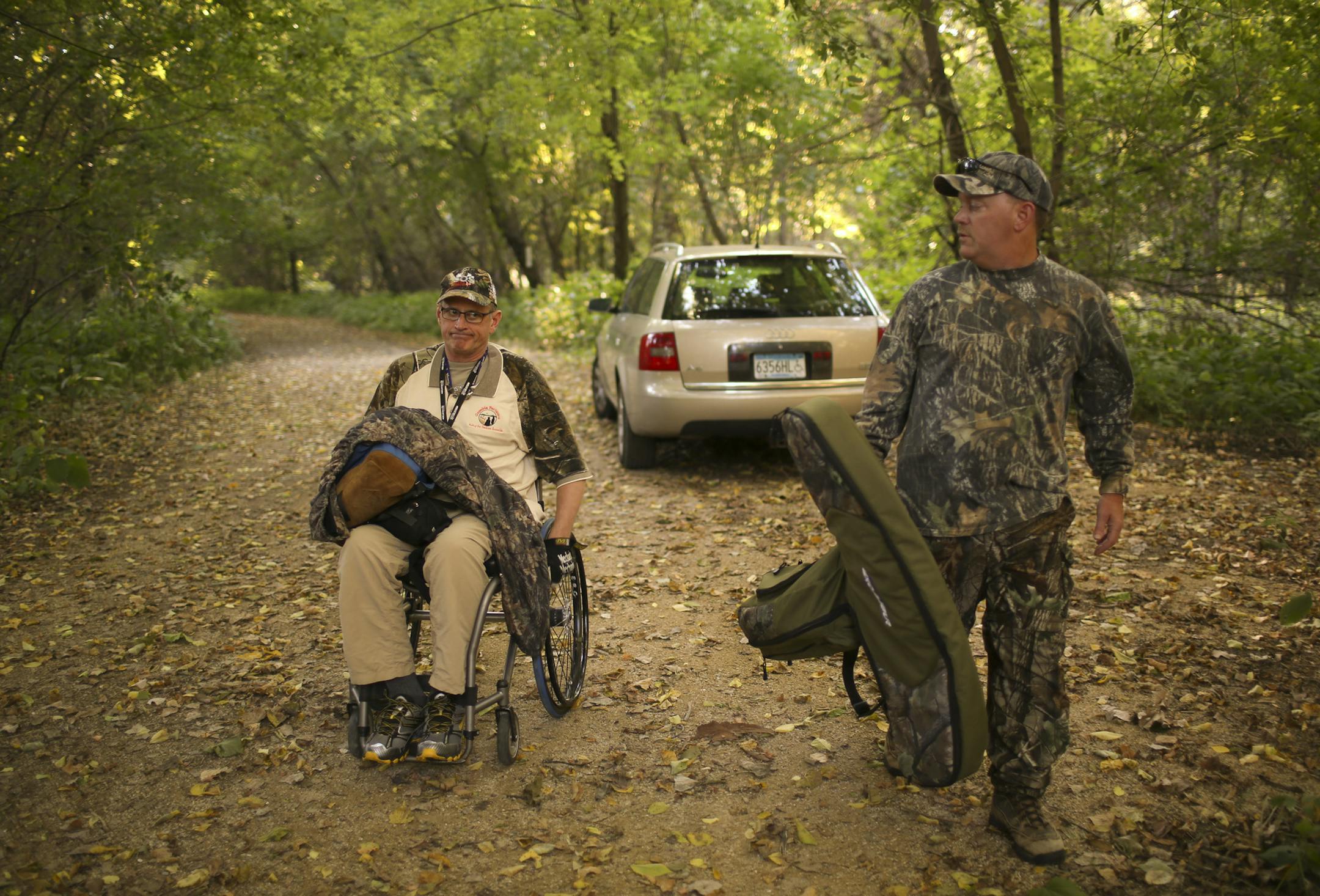 Capable Partners has been helping disabled people hunt and fish for years. Dave Guzzi and an able-bodied friend, Jayme Welsh, hunted deer Thursday evening, September 26, 2013 in a new blind area within the Minnesota Valley National Wildlife Refuge in Bloomington. Dave Guzzi and Jayme Welsh headed to the new hunting platform for an evening of deer hunting. Welsh is carrying the case that contains Guzzi's crossbow. ] JEFF WHEELER ‚Ä¢ jeff.wheeler@startribune.com