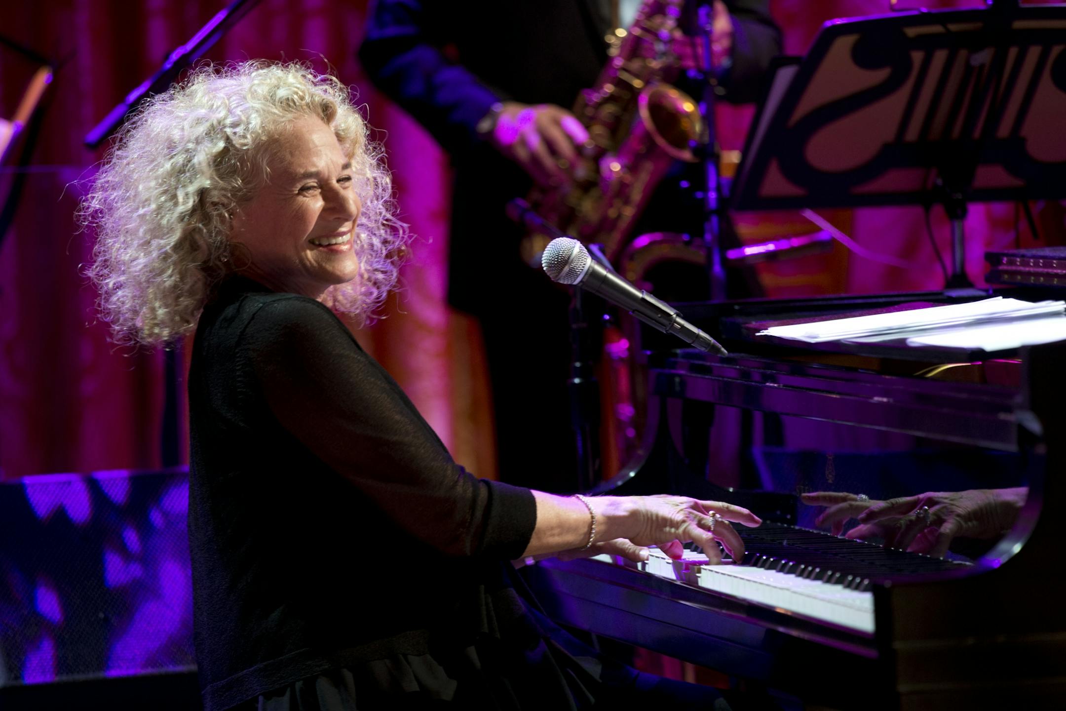 FILE - In this May 22, 2013, file photo, Carole King performs after President Barack Obama presented her with the Library of Congress Gershwin Prize for Popular Song in the East Room of the White House in Washington. Alicia Keys announced Wednesday, Sept. 18. 2013, that King will perform at her Black Ball fundraising gala on Nov. 7 at New York's Hammerstein Ballroom for her charity, Keep a Child Alive.