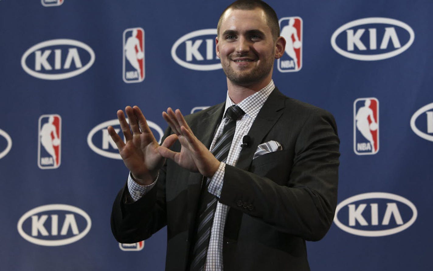 Kevin Love waved at audience members after receiving the Most Improved Player Award during a news conference at Target Center on Thursday.