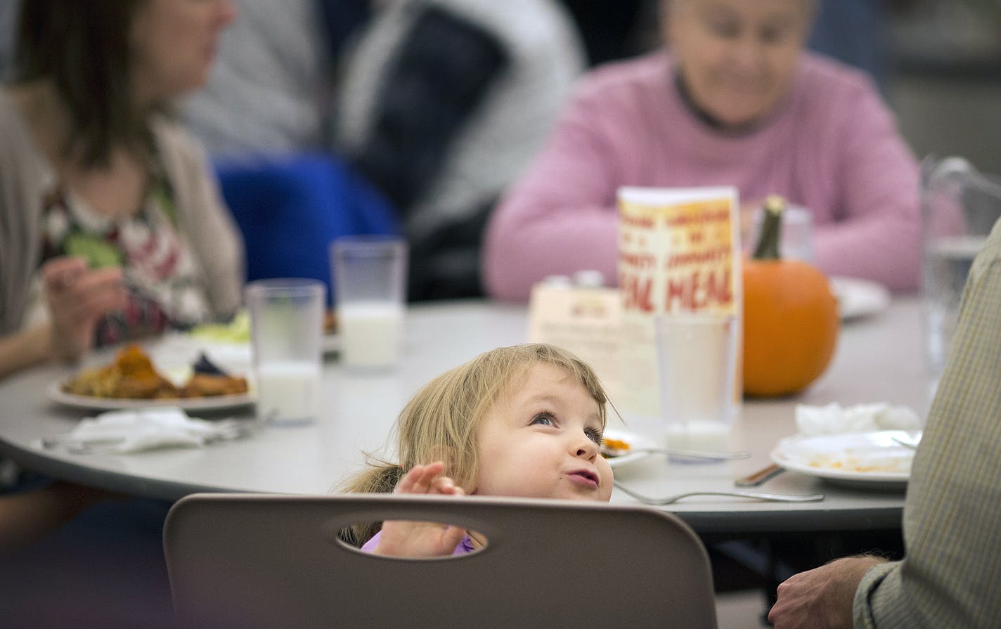 Molly Peschong looked around the room as she ate a meal with her family at a Loaves and Fishes meal on Tuesday, November 24, 2015, at Eastern Lutheran Church in Eagan, Minn. ] RENEE JONES SCHNEIDER &#xef; reneejones@startribune.com ORG XMIT: MIN1511241955150232