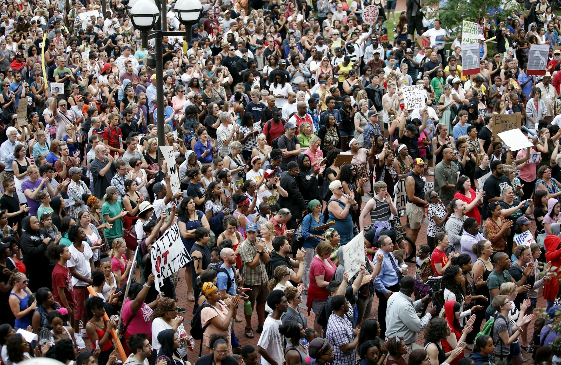 The crowd cheered during a Hoodies up for Trayvon rally at the Hennepin County Government Center in Minneapolis on Monday.