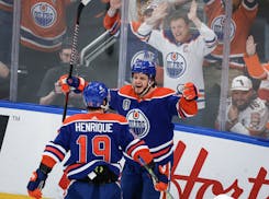 Edmonton Oilers' Mattias Janmark (13) celebrates with Adam Henrique (19) after Janmark's goal against the Florida Panthers during the first period of 